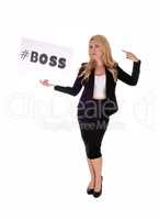 Woman in business suit holding sign.
