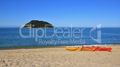 Kayaks at the beach and small island