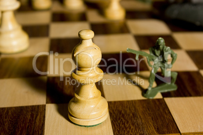 Chess pieces and toy soldiers