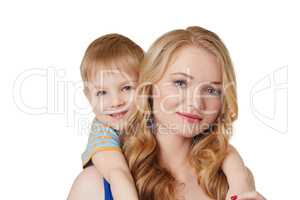 Portrait of pretty mother and son posing at camera