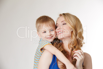 Portrait of happy mother hugging her son