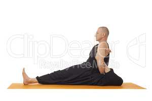 Yoga lessons. Flexible man posing at camera