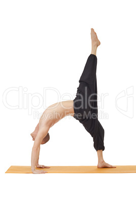 Yoga lessons. Man posing in difficult asana