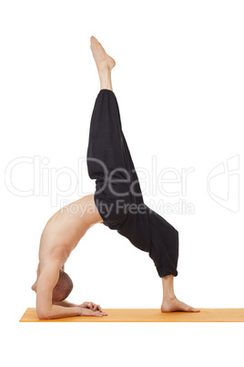 Yoga exercise. Instructor posing in difficult pose
