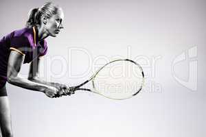 Composite image of tennis player playing tennis with a racket