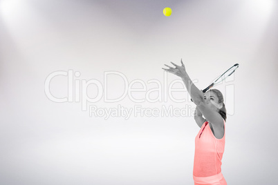 Composite image of athlete holding a tennis racquet ready to ser