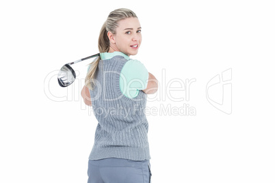 Pretty blonde playing golf