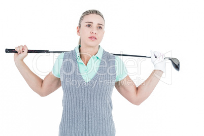 Pretty blonde posing with golf equipment