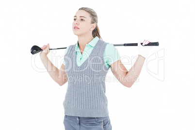 Pretty blonde posing with golf equipment