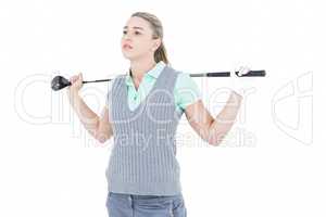 Pretty blonde posing with golf equipment