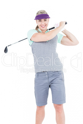 Pretty blonde playing golf