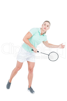 Pretty blonde playing badminton