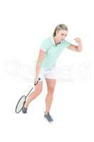 Pretty blonde playing badminton
