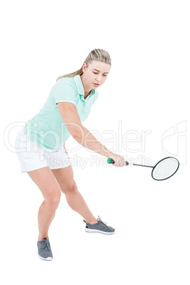 Pretty blonde playing badminton