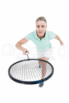 Pretty blonde playing badminton