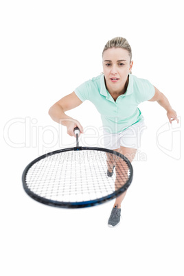 Pretty blonde playing badminton