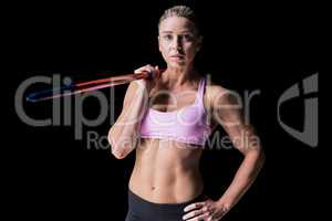 Female athlete holding a javelin