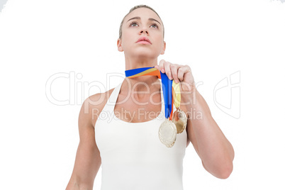 Female athlete holding medals