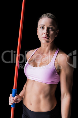 Female athlete holding a javelin