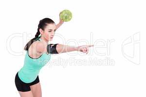 Female athlete with elbow pad throwing handball