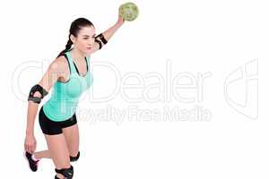 Female athlete with elbow pad throwing handball