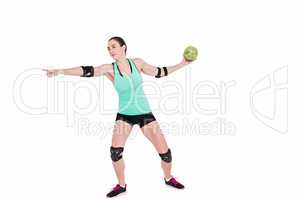 Female athlete with elbow pad throwing handball