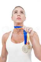 Female athlete holding medals