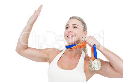 Female athlete holding medals