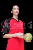 Female athlete holding a hand ball