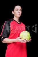 Female athlete holding a hand ball