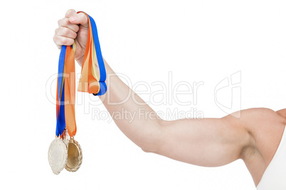 Female athlete holding medals