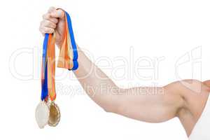 Female athlete holding medals