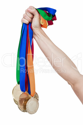 Close up of a hand holding medals