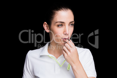 Female athlete blowing a whistle