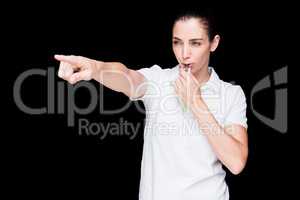 Female athlete blowing a whistle and pointing