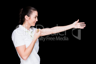 Female athlete blowing a whistle and pointing