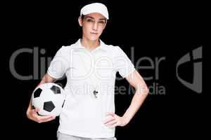 Female athlete holding a soccer ball