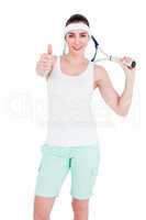 Female athlete posing with tennis racket and showing thumbs up