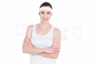 Female athlete posing with crossed arms