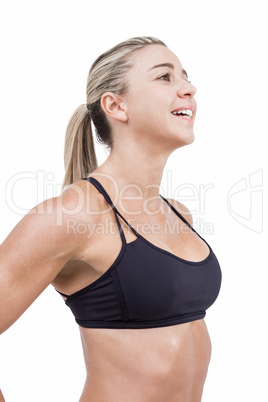 Female athlete posing with hands on hip