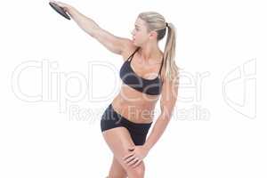 Female athlete throwing discus