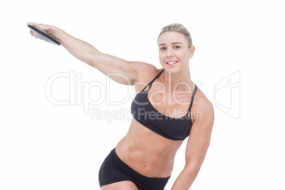 Female athlete throwing discus