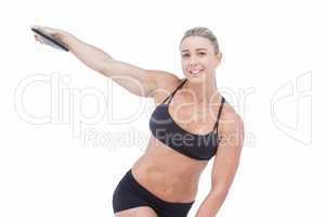 Female athlete throwing discus