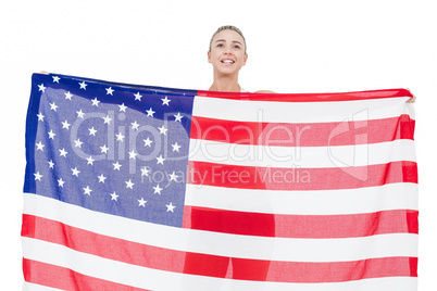 Female athlete holding American flag