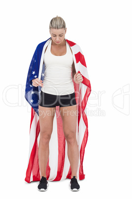 Female athlete holding American flag