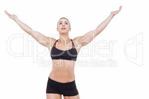 Female athlete raising arms