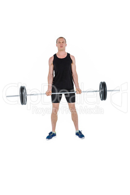 Bodybuilder lifting heavy barbell weights