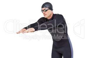Swimmer in wetsuit while diving