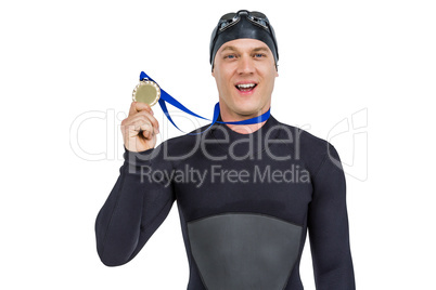Swimmer showing his gold medal