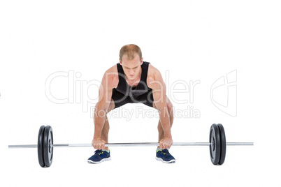 Bodybuilder lifting heavy barbell weights